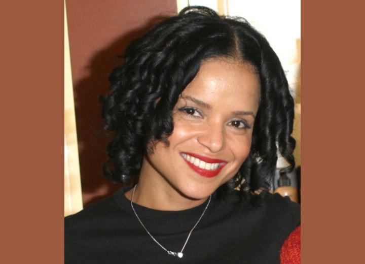Victoria Rowell with her hair in cascade curls