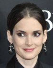 Winona Ryder with her hair pulled back into a knot