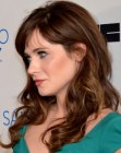 Zooey Deschanel's long retro hair with curls and side bangs