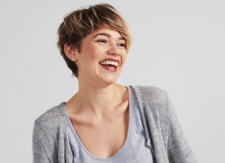 Woman with short hair who is wearing a cute cardigan