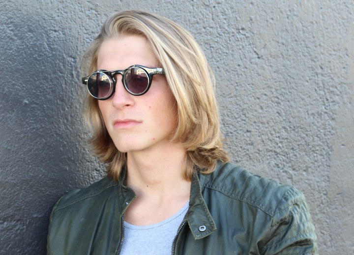 Young man with long blonde hair