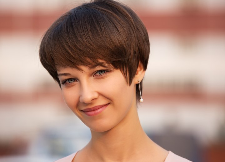Pixie cut with bangs for a brunette