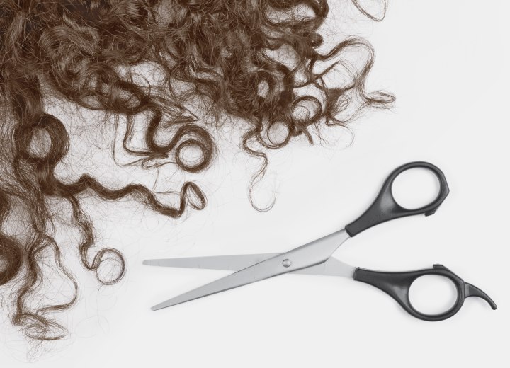 Curly hair and scissors