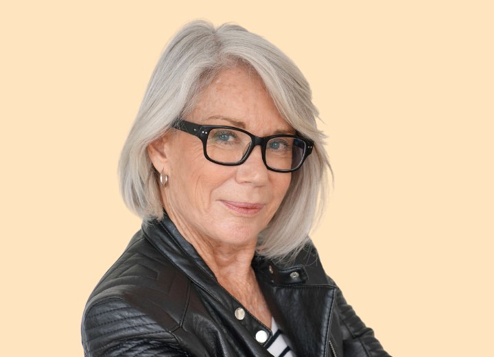 Woman with gray hair wearing glasses