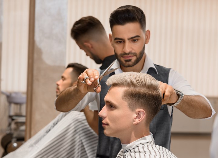 Barber who is cutting a flattop