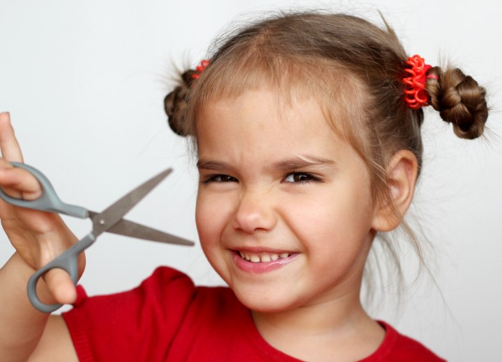 Little girl with scissors