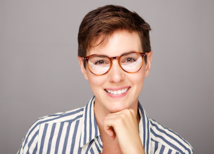 Professional woman with short hair and glasses