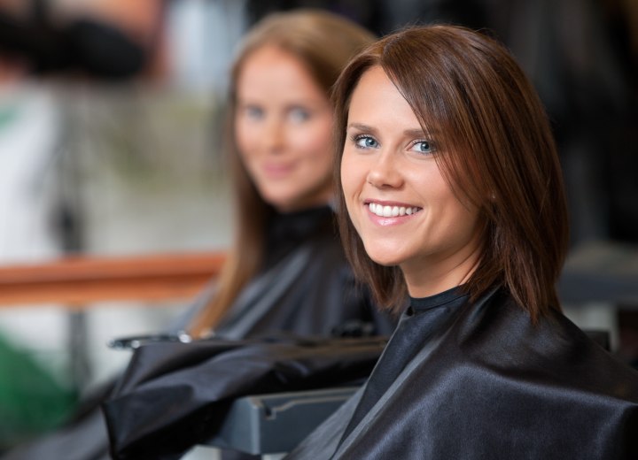 Caped woman at a hair salon