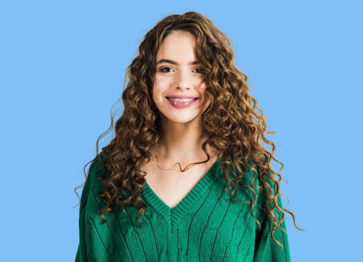 Girl with very long and thick curly hair
