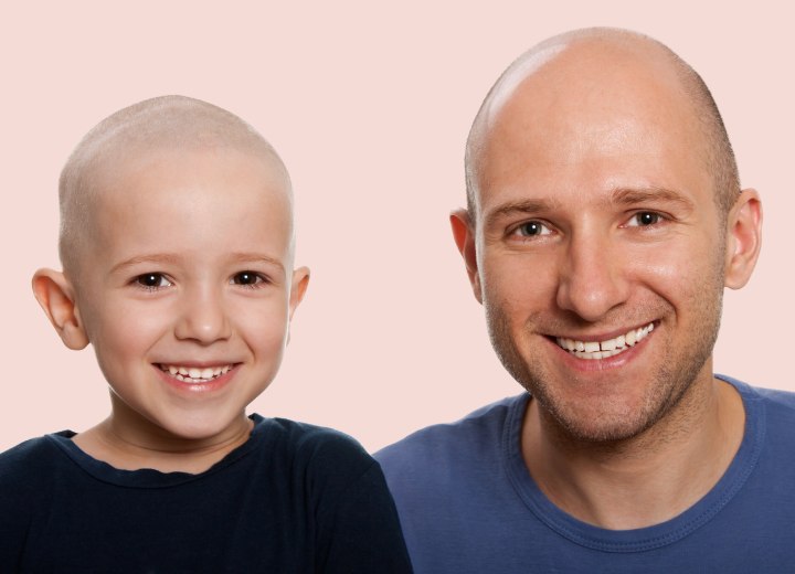Man and child with a bald head