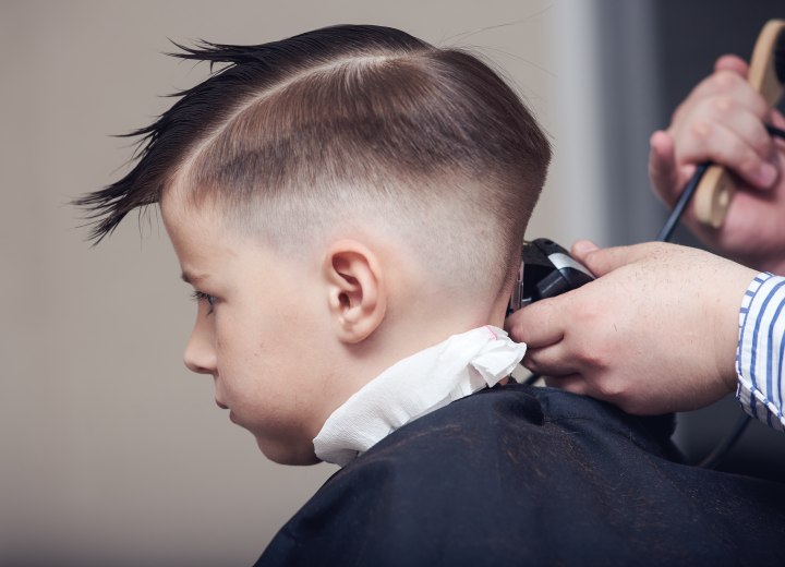 Trimming a child's hair with clippers