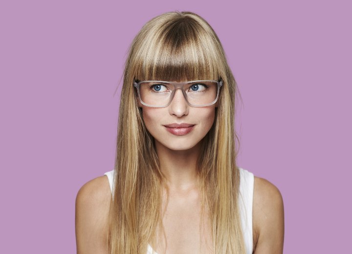 Young lady with long bangs wearing glasses