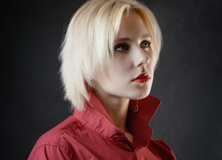 Woman with bleached hair and upturned shirt collar
