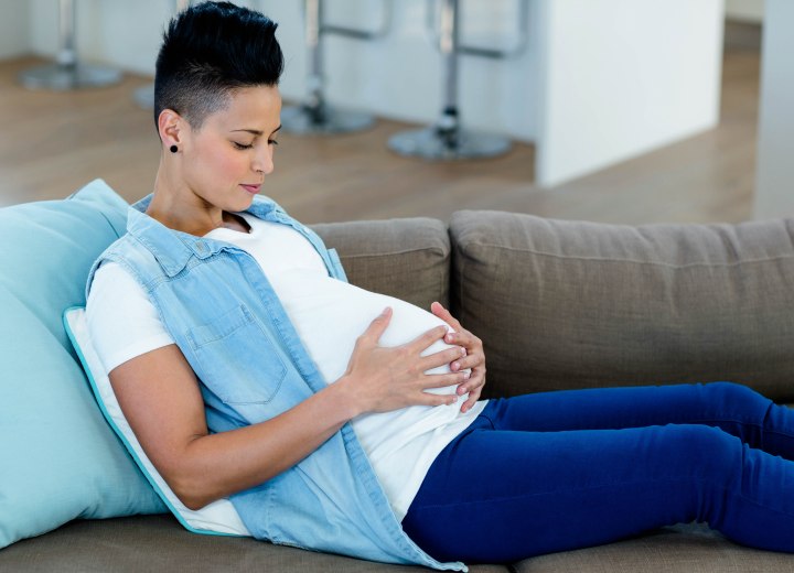 Pregnant woman with very short hair