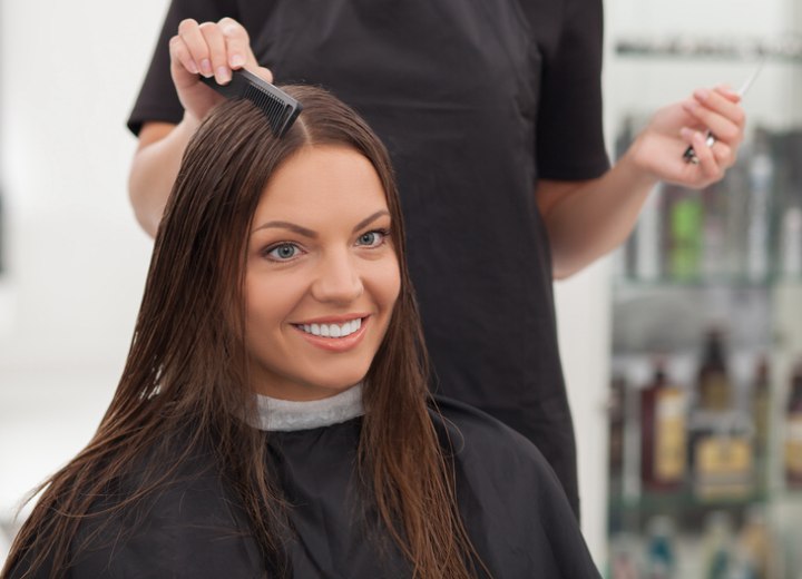 Hair salon client wearing a cutting cape and neck strip