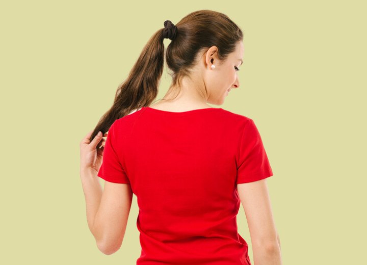 Woman who is ready to cut her ponytail