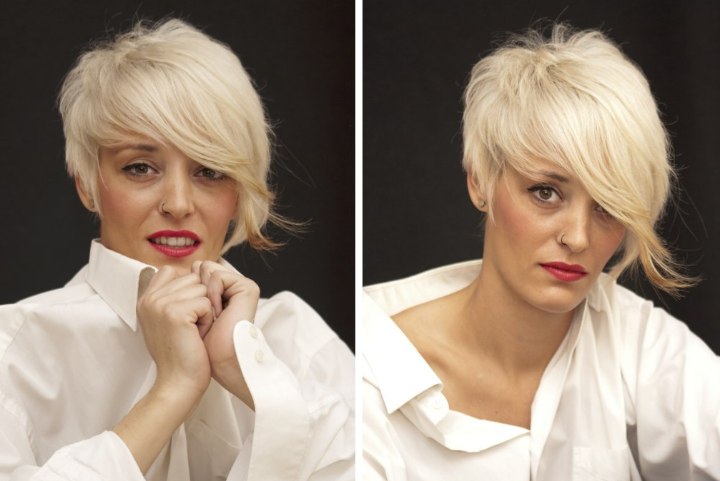 Girl with short bleached hair wearing a white men's shirt