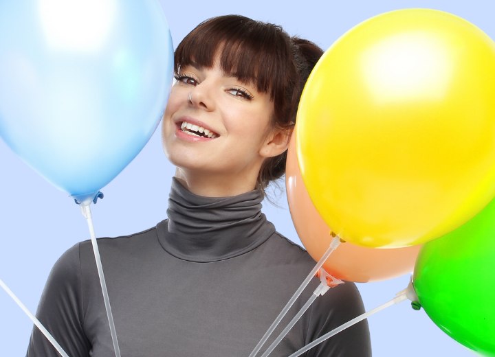 Happy young lady wearing a smooth shiny turtleneck with a scrunched collar
