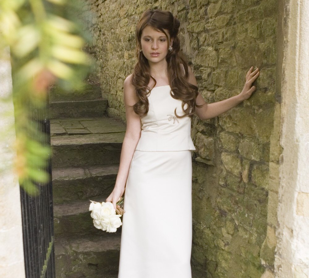 Effortless look wedding hairstyle with extensions and cascade of waves