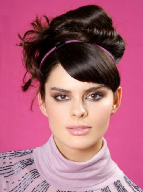 Long hair in a 60s style updo hairstyle