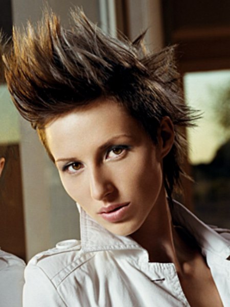 Punk rock hairstyle with spikes, undercut sides and gel