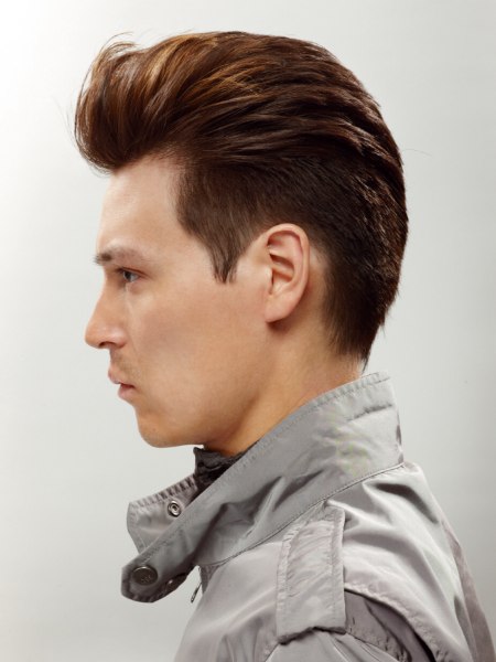 Side view of a short mens haircut with a quiff and a clipped nape