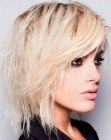 Blonde mid length hair with heavy texture
