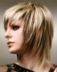 Blonde medium length hair with tapered sides