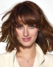 trendy haircut with thick bangs
