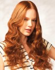 Long copper hair with curls and a middle part