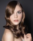 Long brown hair with finger-waving and a smooth finish