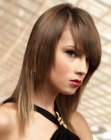 Youthful long hairstyle with razor cut edges and asymmetric bangs