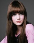Long and straight brown hair with broad, curved bangs