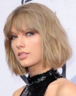 Taylor Swift sporting a halfway the neck bob tousled bob