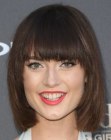 Lacey Rogers sporting a bob with full bangs and tapered sides