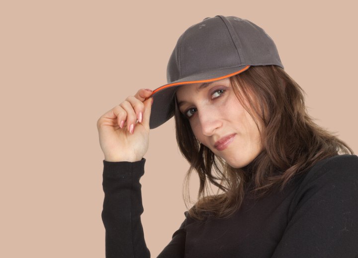 Young woman who is wearing a baseball cap