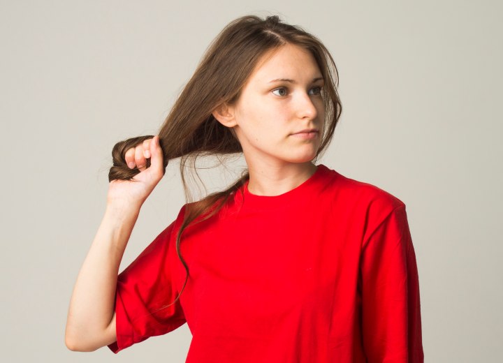 Girl with long hair thinking of growth