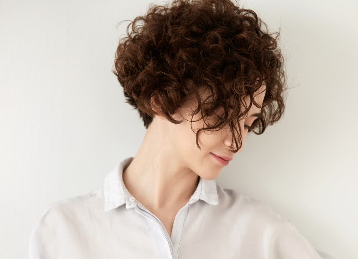 Woman with short and curly above the collar hair