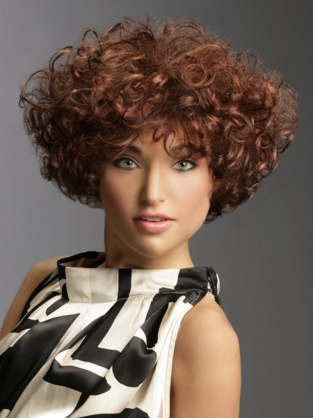 Short hairstyle with a wedge shape and big soft curls