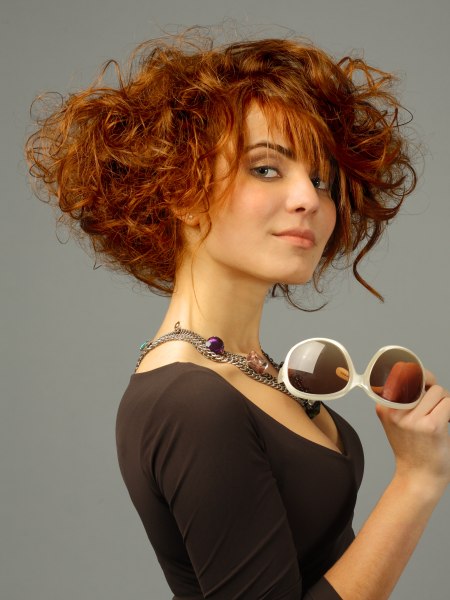 Curly copper hair in a style with a long neckline