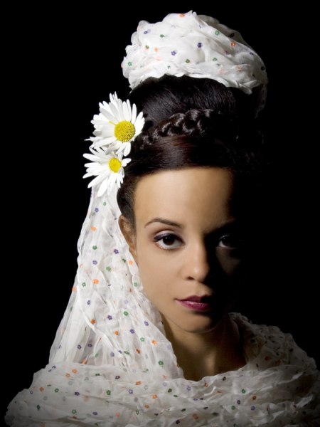 Wedding hairstyle with daisies for dark hair