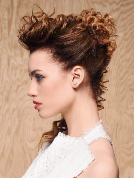 Upstyle with curls and spirals that adorn the neck