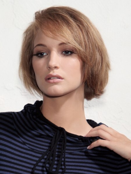 Razor-cut bob with layering and a curved fringe