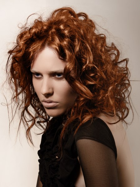 Messy styling for copper colored hair with curls
