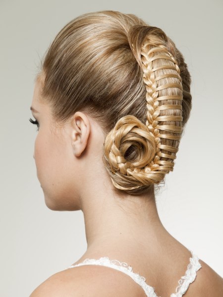 Updo with woven hair gathered to the center of the crown
