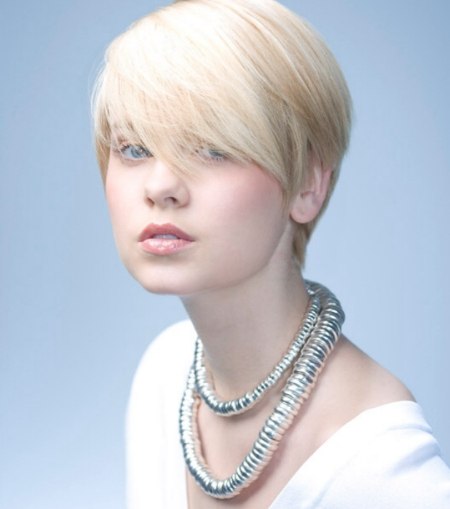 Short shorn haircut with a long fringe