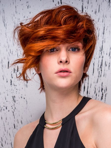Short red hair with a long asymmetrical fringe