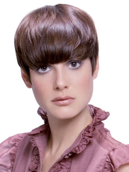 Pixie cut with thick bangs and sideburns