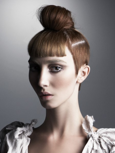 Hair with short sides and a knot on top of the head