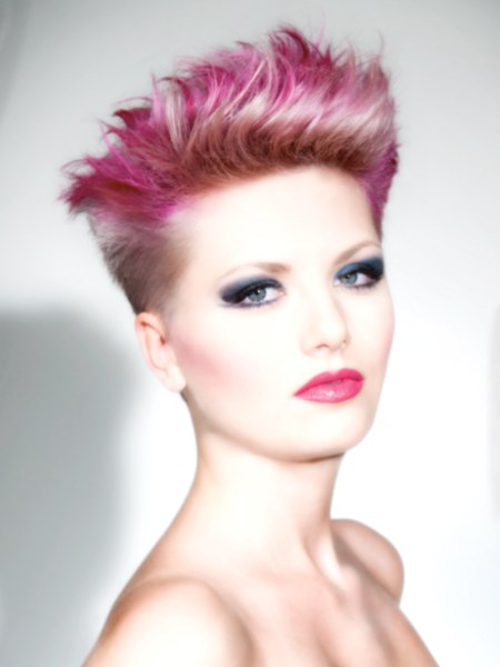 Female punky hair with short sides and pink hues